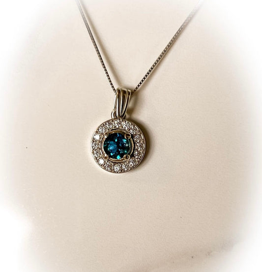 London Blue topaz and Moissanite halo in 14k white gold