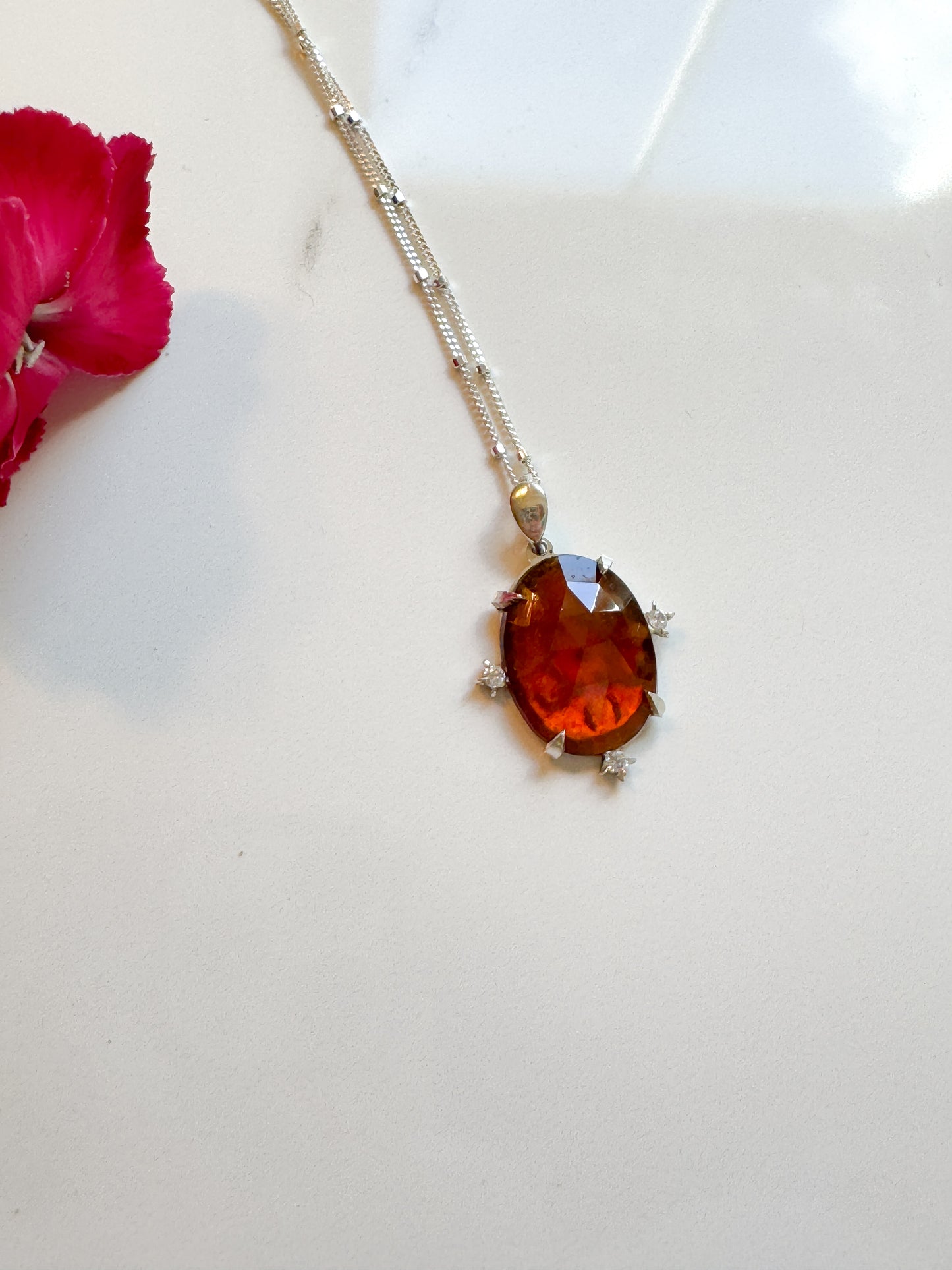 Gorgeous Hand-cut Garnet accented with lab diamonds