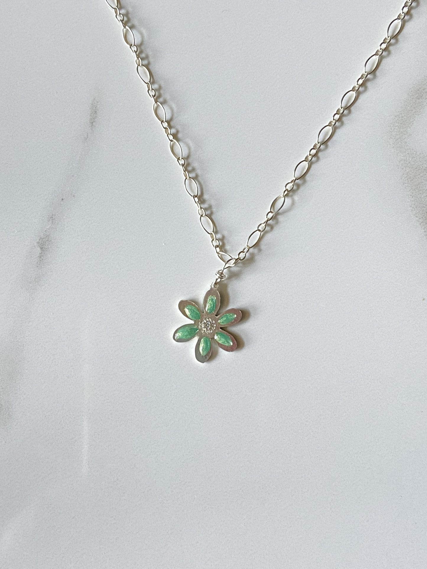 Delicate Sterling teal epoxy pigmented flower with Moissanite accent