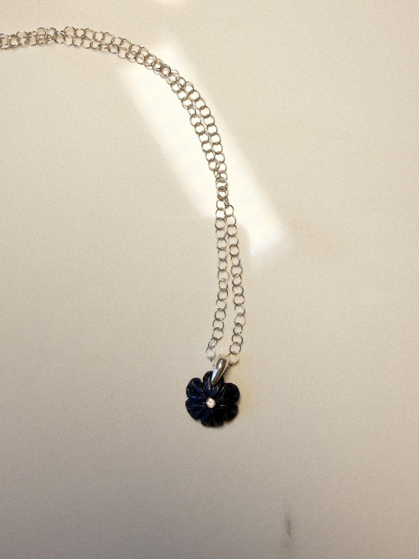Deep blue Lapis carved flower with Zircon