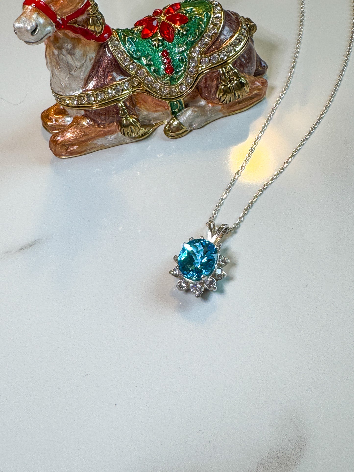 Fancy cut Swiss blue topaz and CZ pendant