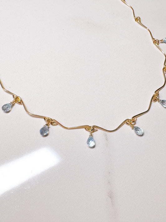Gold filled hammered necklace with blue Topaz