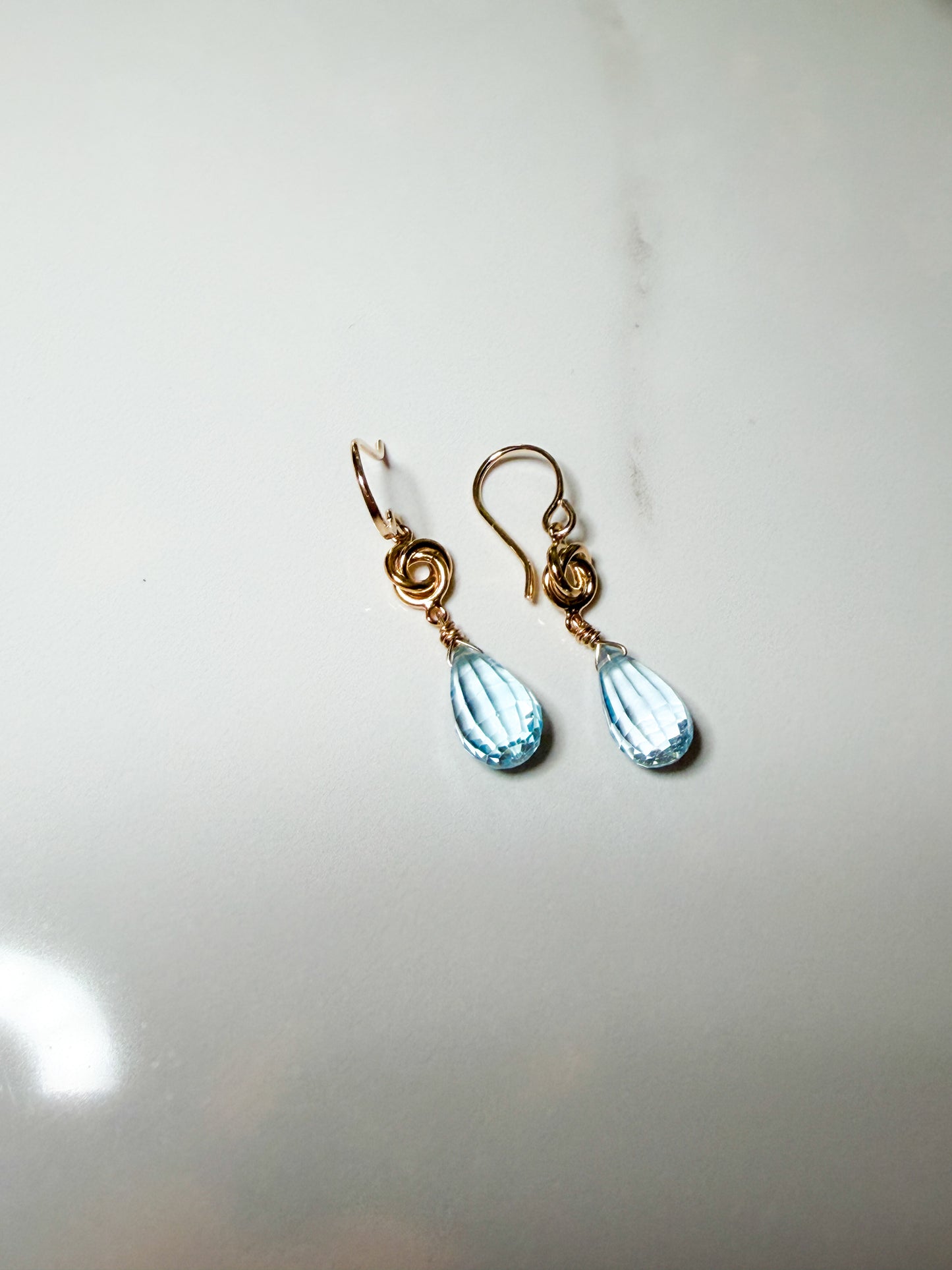 Gold filled petite knot sky blue Topaz earrings