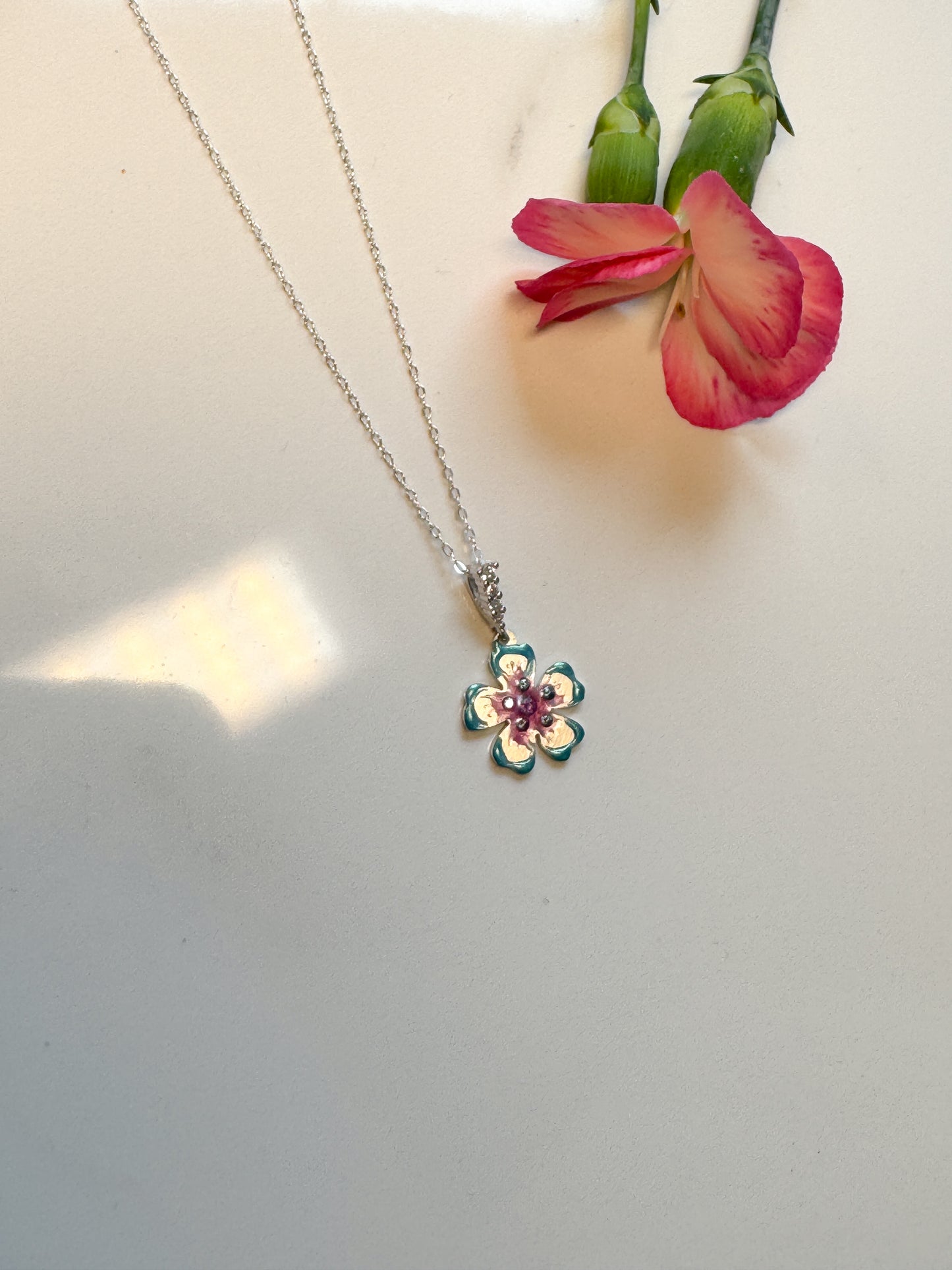 Hand cut pink and blue Moissanite flower pendant