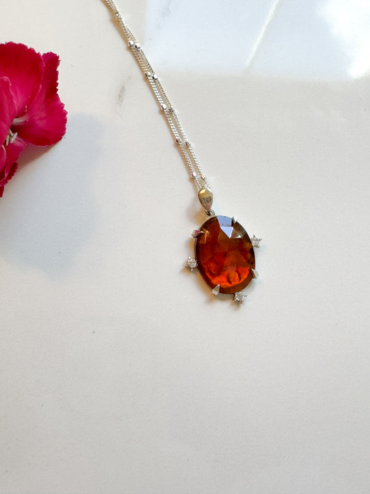 Gorgeous Hand-cut Garnet accented with lab diamonds