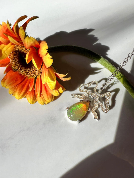 Ethiopian Opal hand cut crystal bow pendant