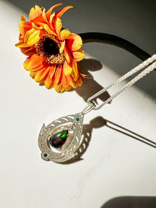 Black Opal drop pendant with blue diamond, white zircon & Moissanite