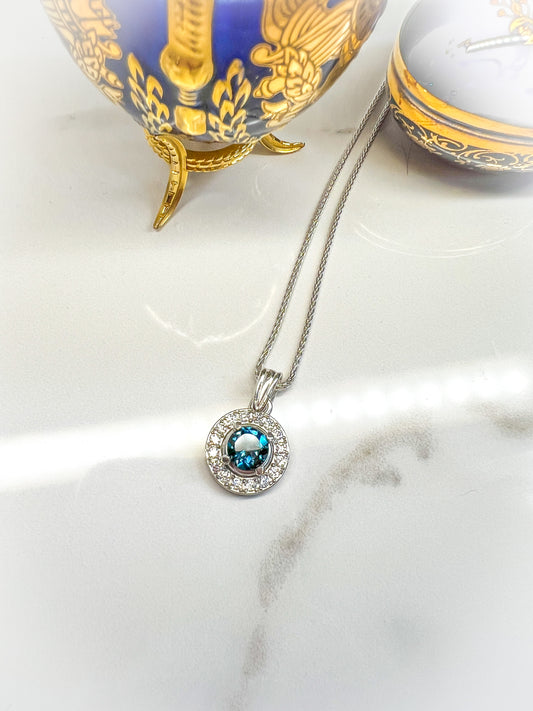 Moissanite & London blue Topaz Sterling halo pendant